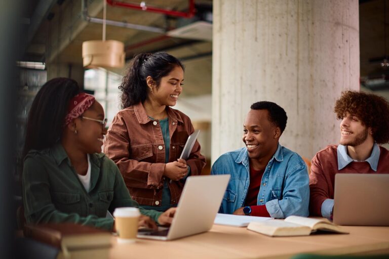 happy-diverse-students-communicating-while-learnin-2026-03-07-22-10-39-utc.jpg