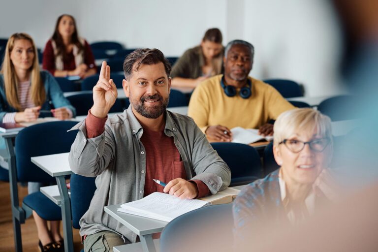 mature-man-raising-hand-to-ask-a-question-while-at-2026-01-06-10-28-53-utc.jpg