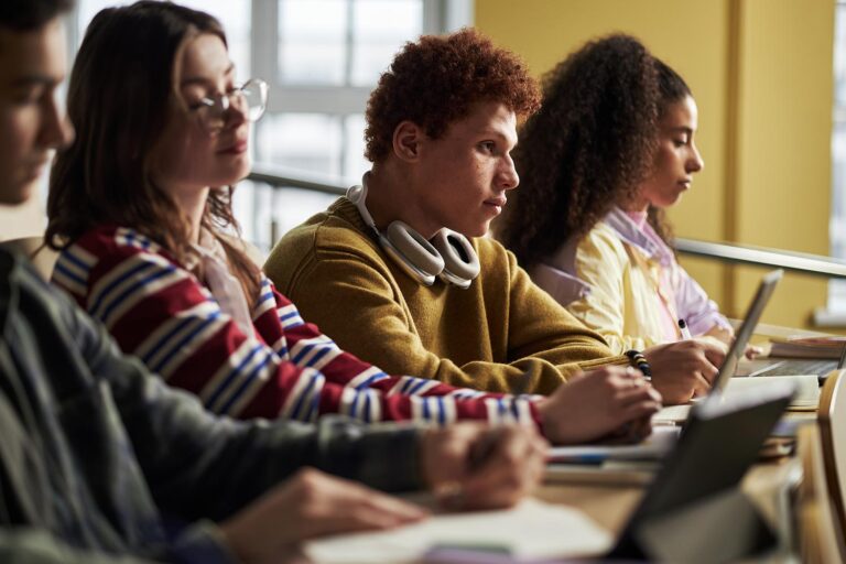 multiethnic-young-adult-students-listening-and-wri-2026-01-09-11-58-49-utc.jpg